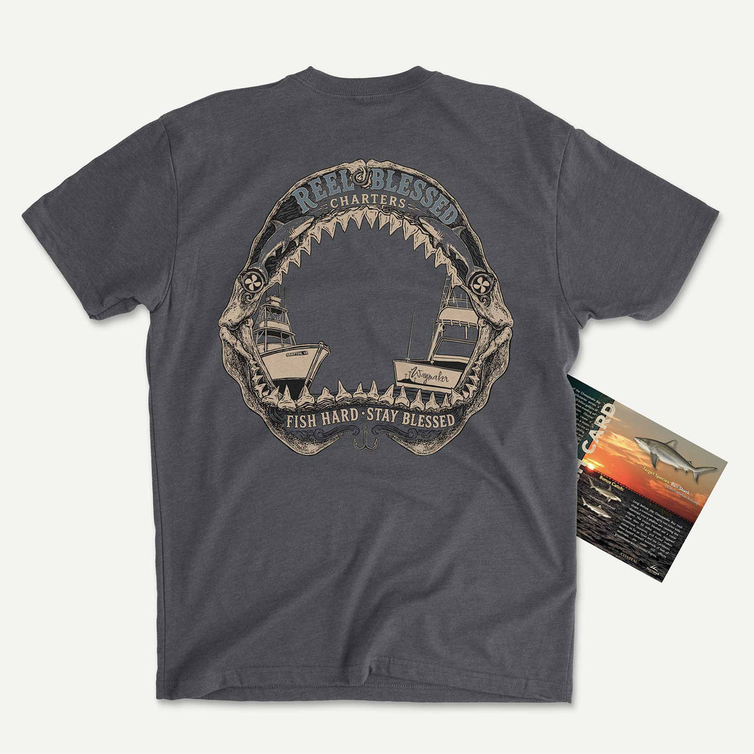 Heather Heavy Metal t-shirt with shark jaws framing two sportfishing boats: Reel Blessed Charters, Fish Hard, Stay Blessed, with its Catch Card