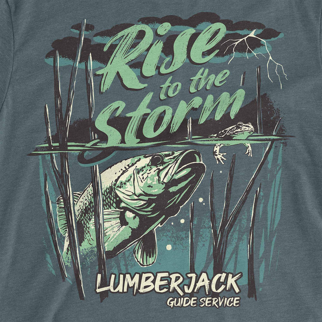 Heather Slate Blue t-shirt with a largemouth bass rising through standing timber under a storm: Rise to the Storm